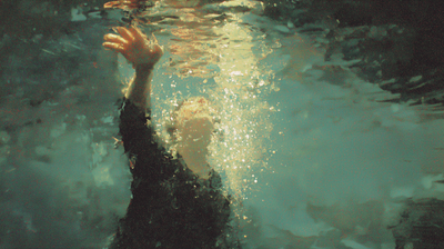 Breathers cover — a figure reaching upward through water toward the light at the surface