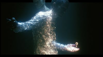 A close, shimmering figure made of sparkling text-particles: one arm reaches left toward a thin bright blade of light, while the other hand opens palm-up at lower right, cupping a small glowing amber question mark.