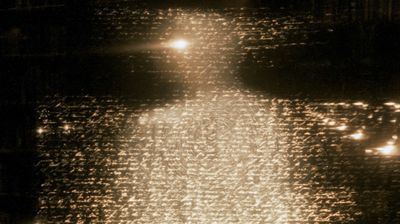 A cosmic whirlpool of golden words spirals across the dark frame, the human figure dissolved entirely into streaming text.