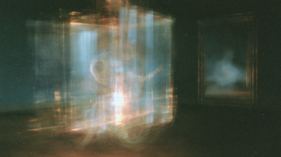 A large translucent blue lantern glows amber at its base, with a dim window floating to its right.